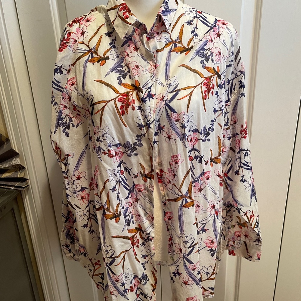 Women’s button up blouse. Pretty cream base with blue, rust, pink print.